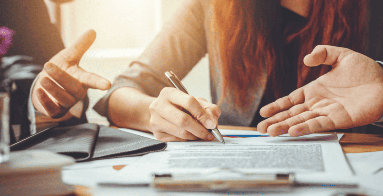 Business people, signing documents.