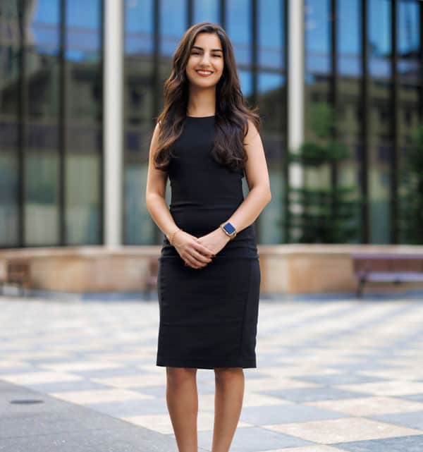 Shadi, a woman in a black dress.