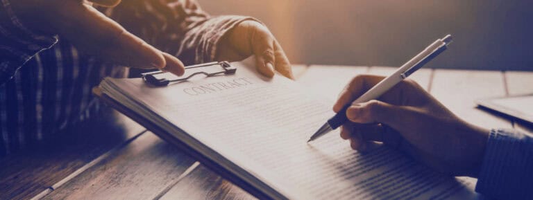 Two people discussing about a construction contract with clauses on liquidated damages