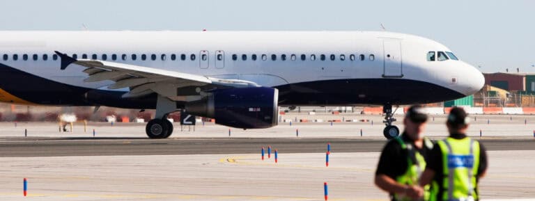 airplane and airport police implying the airport watchlist in family law
