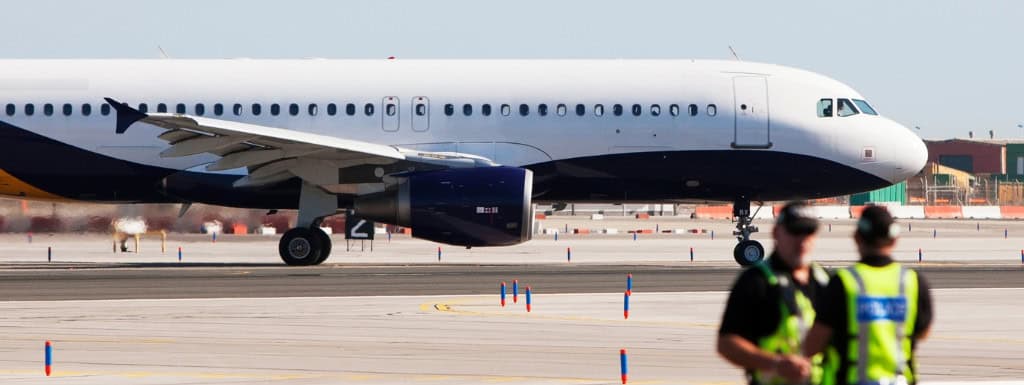 airplane and airport police implying the airport watchlist in family law