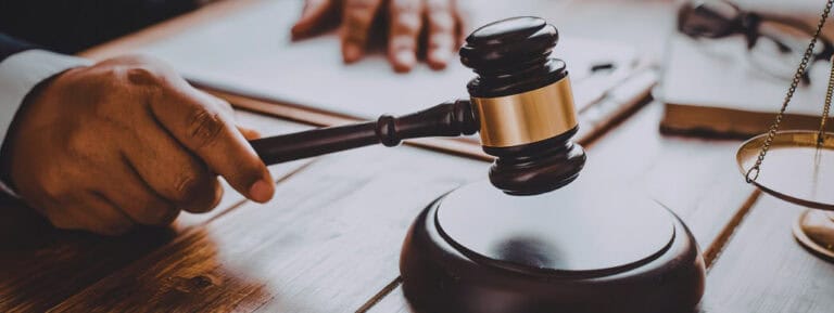 Judge's gavel on a desk in a courtroom
